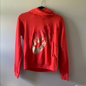 Red Nike Highneck sweatshirt.